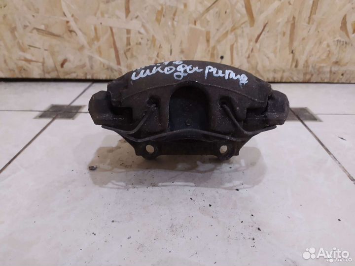 Тормозной суппорт передний правый Skoda Rapid