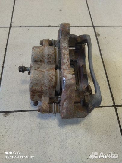 Суппорт тормозной передний левый Chery Tiggo 5 T21