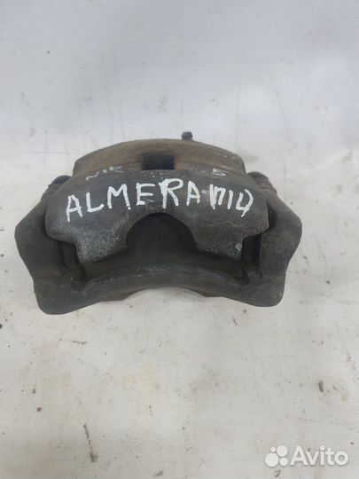 Суппорт тормозной передний левый Nissan Almera N16