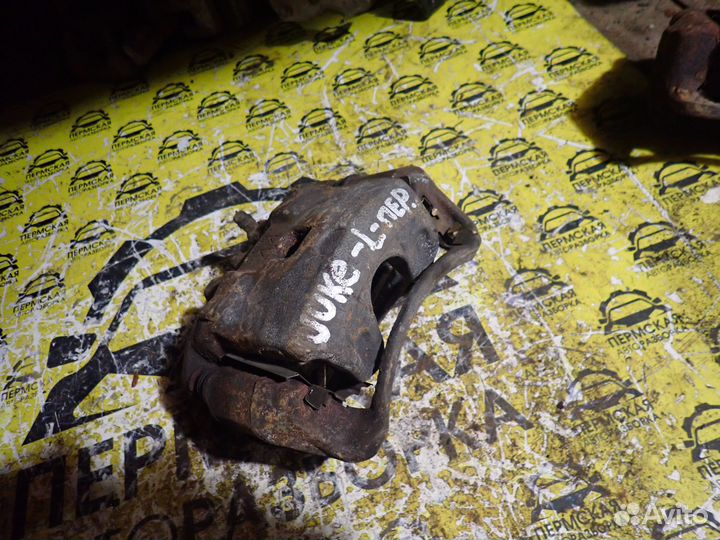 Суппорт тормозной передний левый для Nissan Juke