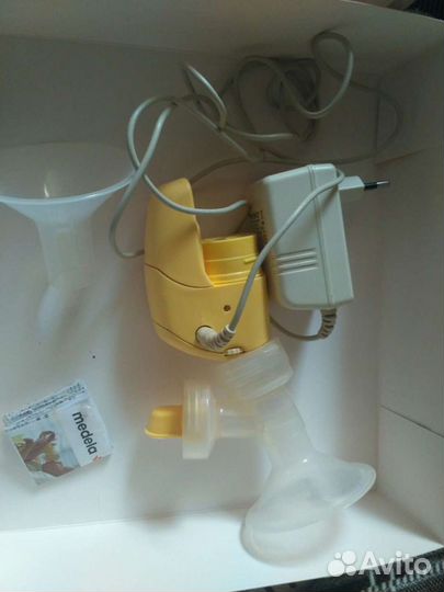 Молокоотсос medela электрический