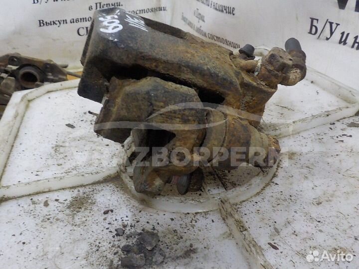 Суппорт тормозной задний левый Geely MK