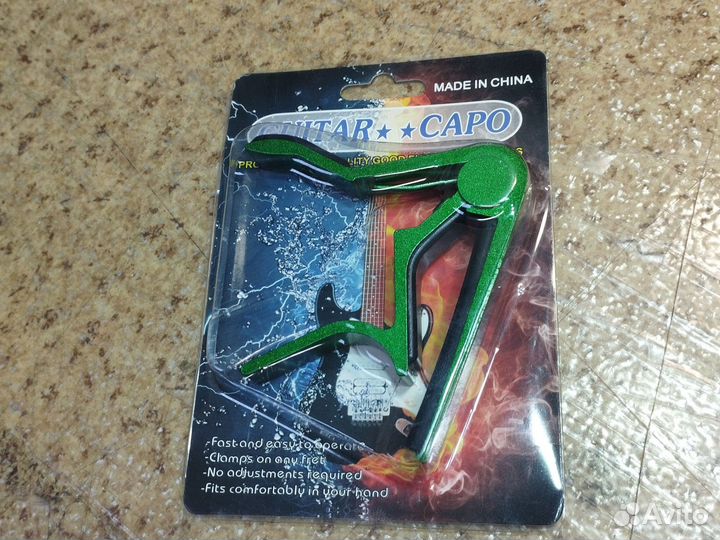 Каподастр для гитары зелёный алюминиевый