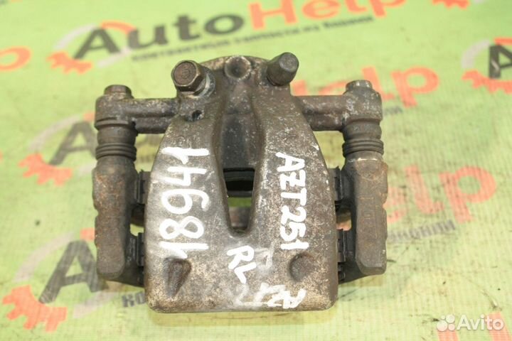 Суппорт toyota avensis AZT250 задний левый