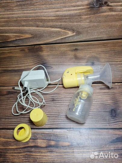 Молокоотсос medela электрический