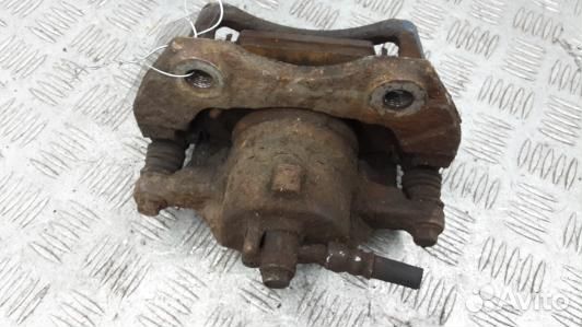 Суппорт тормозной передний левый nissan almera tin