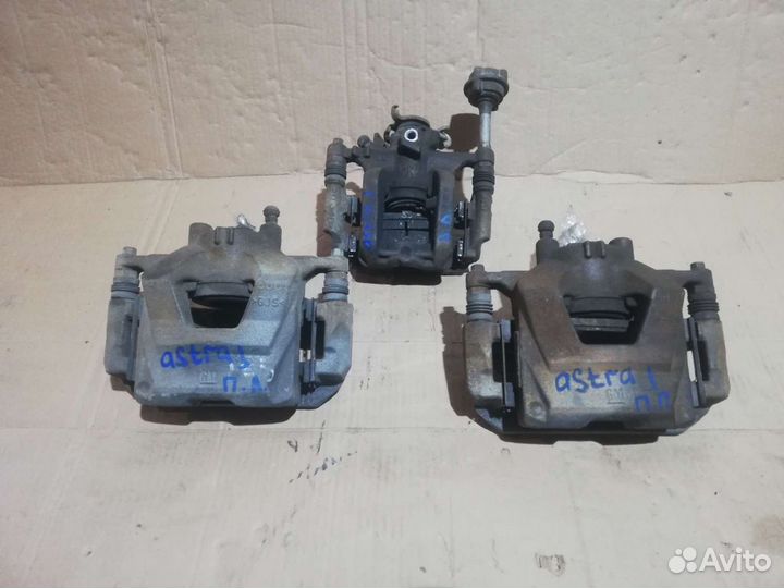 Суппорт тормозной Opel Astra J