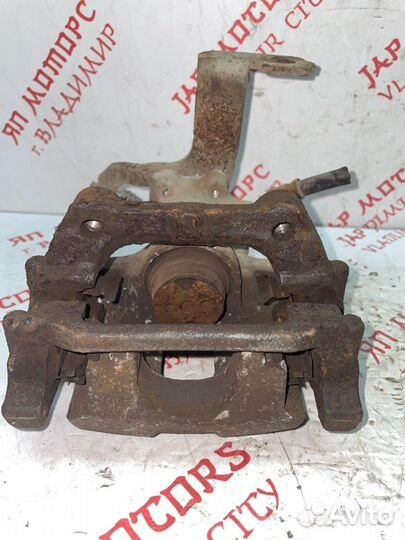 Суппорт тормозной задний левый Toyota Avensis T270