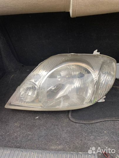 Фара передняя левая Toyota Corolla Runx / Fielder