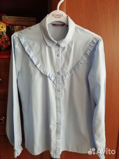 Блузка голубая