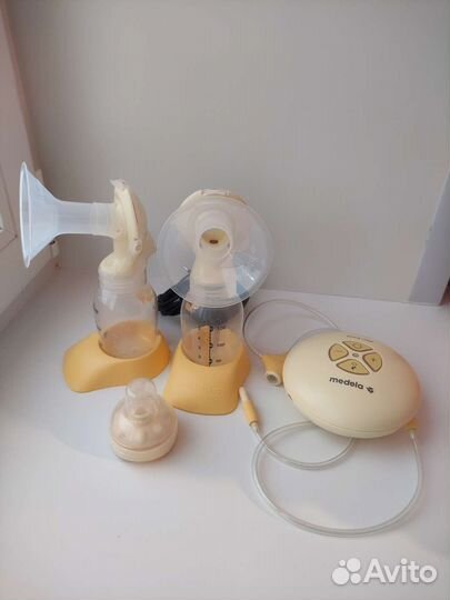 Молокоотсос Medela Swing Maxi & Calma двойной