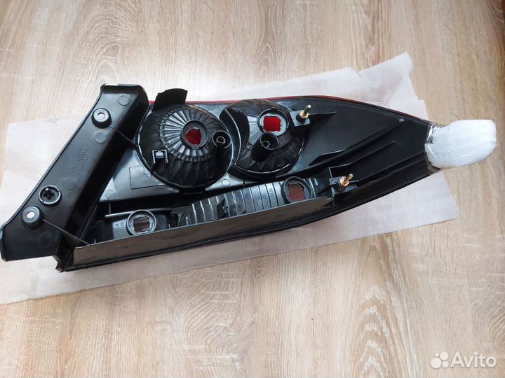 Фонарь левый новый неоргинал Mitsubishi Lancer IX