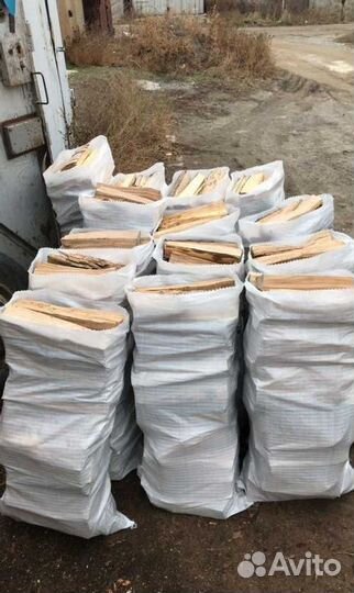 Дрова колотые в мешках