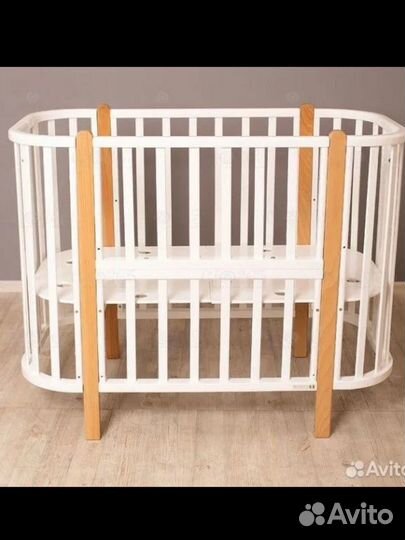 Детская кроватка с маятником