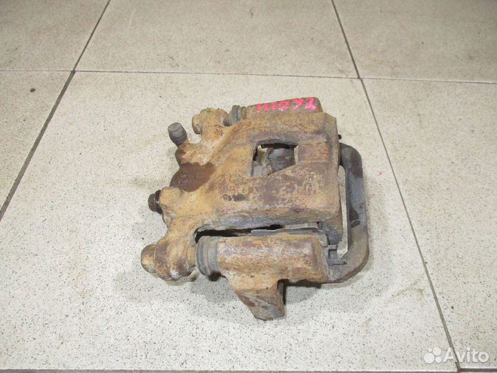 Суппорт задний правый Nissan Tiida (C11)