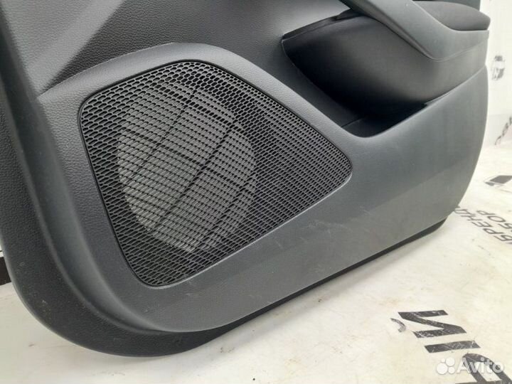 Обшивка двери передняя правая Toyota Corolla 210