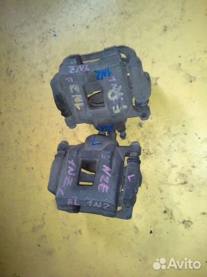 Суппорт передний на toyota allex NZE121 1NZ