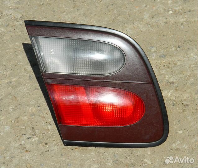 Фонарь багажника левый Almera N15