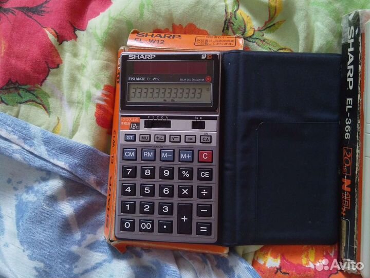 Электронный калькулятор sharp