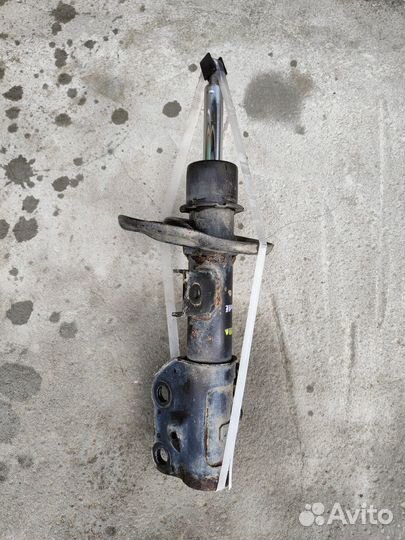 Стойка амортизатор, передняя, левая оригинал