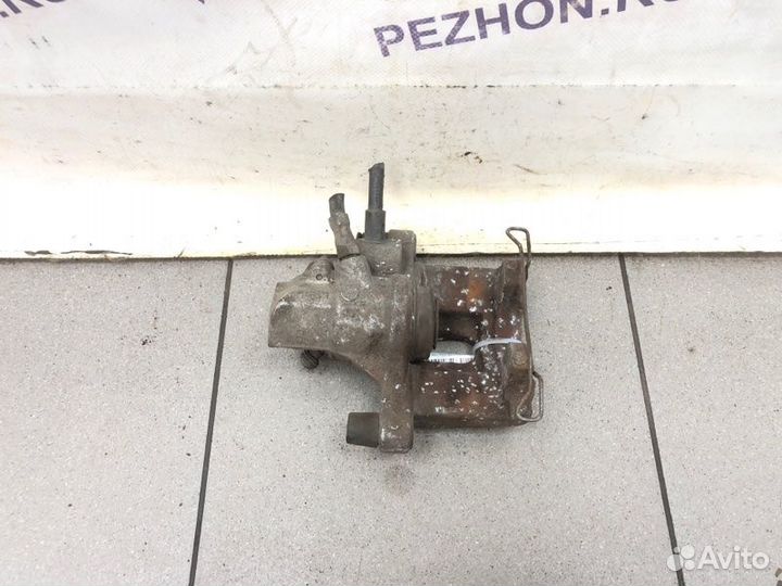 Суппорт тормозной задний левый Ford Focus хэтчбек