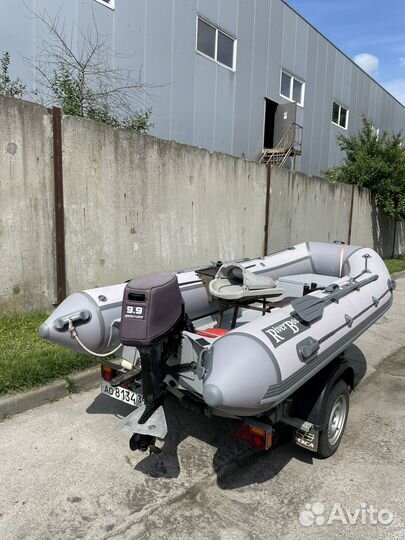 Лодка риб с мотором и прицепом