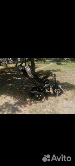 Детский трехколесный велосипед с поворотом сидения