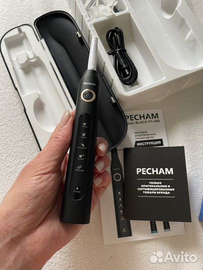 Электрическая зубная щетка