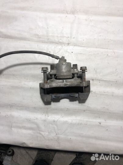 Тормозной супорт левый Фольксваген пассат b6