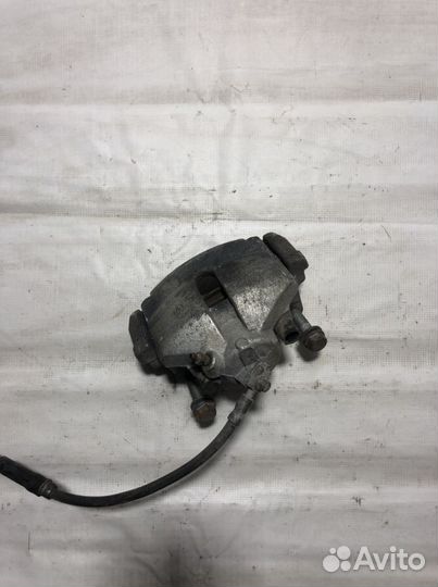 Тормозной супорт левый Фольксваген пассат b6