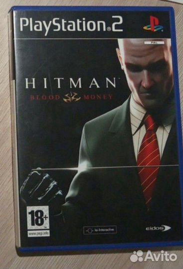 Игровая консоль PlayStation 2 и 2 игры