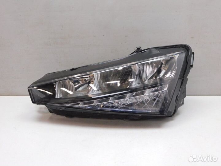 Фара левая Skoda Rapid