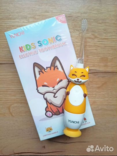 Электрическая зубная щетка