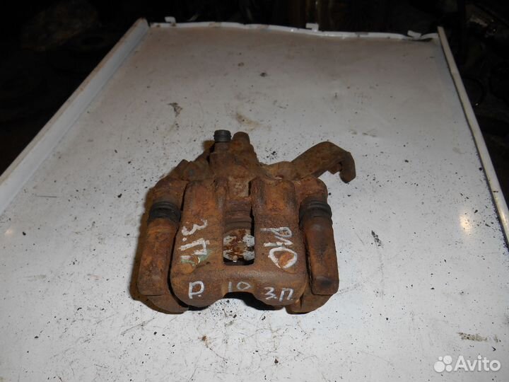 Суппорт задний правый Nissan Primera P10