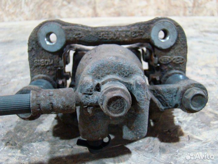 KIA Sportage 2 Суппорт тормозной задний правый