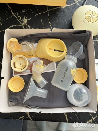 Молокоотсос medela электрический