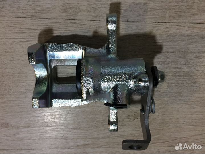 Суппорт задний левый оригинал новый Солярис Рио 3