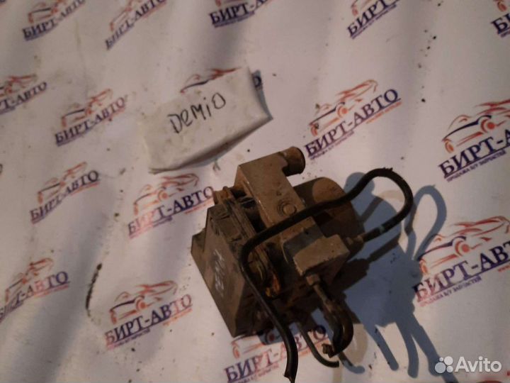 Блок abs mazda demio