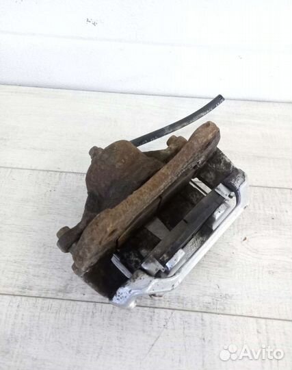 Суппорт передний левый Kia Cerato 2