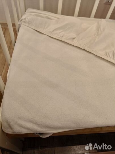 Детская кроватка с продольным маятником