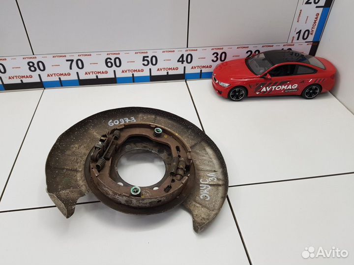 Пыльник заднего диска с колодками левый