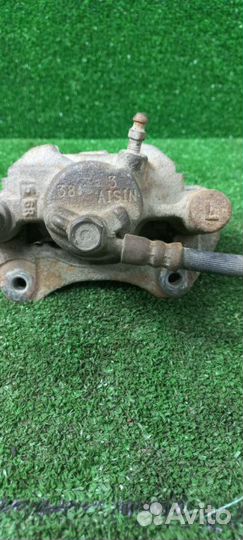 Суппорт тормозной задний левый Toyota Camry ACV30