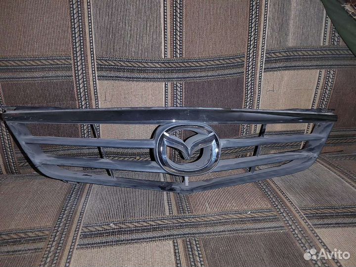 Решетка радиатора Mazda capella GG3E50712