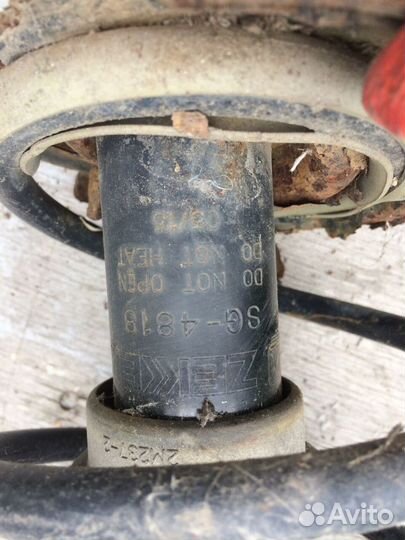 Амортизатор передний левый стойка Nissan Note