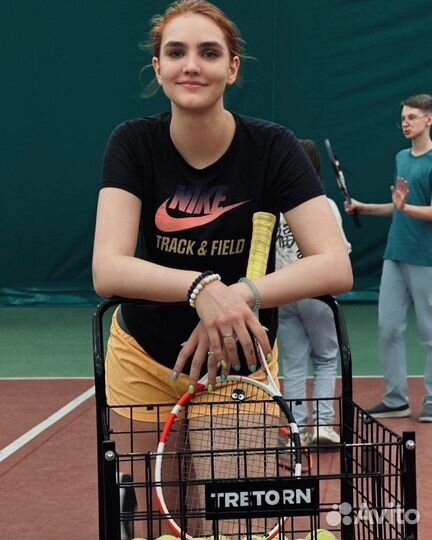 Тренер по большому теннису