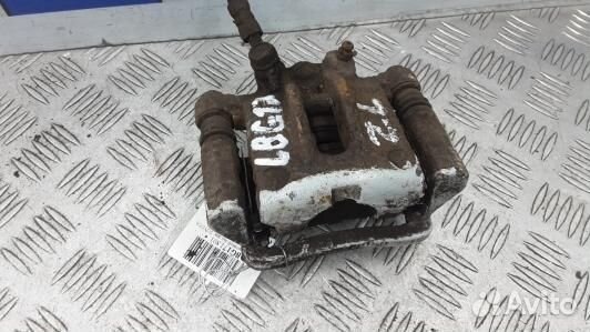Суппорт тормозной задний левый toyota corolla E12