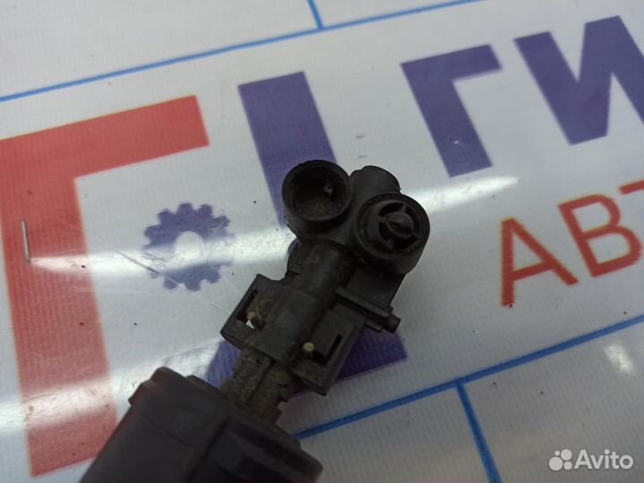 Форсунка омывателя фары левая Nissan Primera (P12)