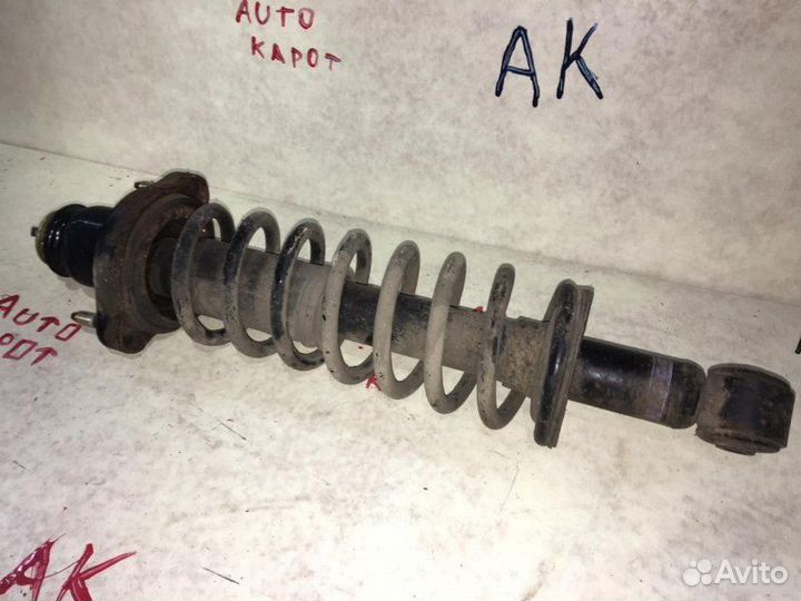 Аммортизатор стойка задний левый Mitsubishi Lancer