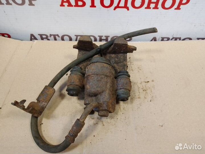 Суппорт тормозной задний левый Dodge Stratus 2.4