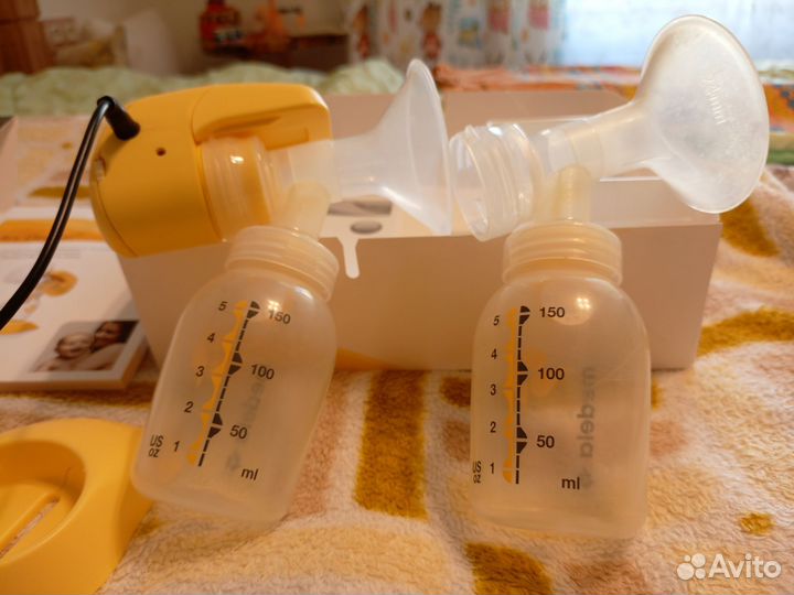 Молокоотсос medela электрический